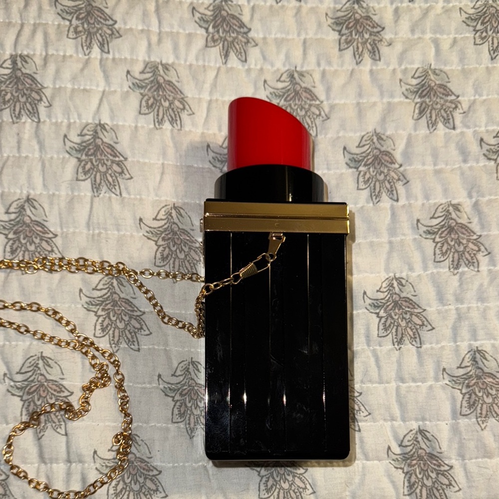 Elegant Black and Gold Lipstick-Shaped Clutch